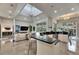 Bright kitchen featuring a breakfast bar island that is seamlessly connected to the living room at 706 Manns Harbor Dr, Apollo Beach, FL 33572