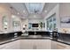 Open concept kitchen featuring a sink, island seating, and modern appliances for a seamless cooking experience at 706 Manns Harbor Dr, Apollo Beach, FL 33572