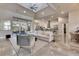 Bright open-concept living room with seamless flow to the kitchen, dining, and outdoor areas at 706 Manns Harbor Dr, Apollo Beach, FL 33572