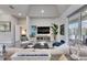 Spacious living room featuring stylish decor, including a large TV and comfortable seating arrangement at 706 Manns Harbor Dr, Apollo Beach, FL 33572