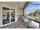 Outdoor kitchen featuring a stainless steel grill and bar seating area at 706 Manns Harbor Dr, Apollo Beach, FL 33572