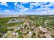 An aerial view showcasing the property's location near the water and a well-established neighborhood at 7113 S Mascotte St, Tampa, FL 33616