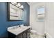Stylish bathroom featuring a marble vanity and modern fixtures at 7113 S Mascotte St, Tampa, FL 33616