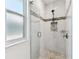 Modern bathroom featuring a glass shower with mosaic tile accents at 7113 S Mascotte St, Tampa, FL 33616