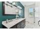 Stylish bathroom featuring dual sinks, modern fixtures, and ample counter space at 7113 S Mascotte St, Tampa, FL 33616