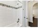 Clean bathroom with a white tiled shower and modern fixtures at 7113 S Mascotte St, Tampa, FL 33616