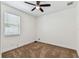 Neutral bedroom with a ceiling fan and window at 7113 S Mascotte St, Tampa, FL 33616