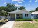 Charming home with a well-maintained yard, inviting curb appeal, and an attached garage at 7113 S Mascotte St, Tampa, FL 33616