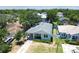 Aerial view of a charming home with a well-maintained yard, inviting curb appeal, and a long driveway at 7113 S Mascotte St, Tampa, FL 33616