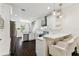 Modern kitchen features a breakfast bar, stainless appliances, and white cabinets at 7113 S Mascotte St, Tampa, FL 33616
