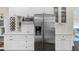 Bright kitchen featuring stainless appliances, custom wine rack, and ample counter space at 7113 S Mascotte St, Tampa, FL 33616