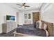Cozy main bedroom with modern decor, dark wood floors, and ample natural light at 7113 S Mascotte St, Tampa, FL 33616