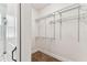 Efficient walk-in closet with adjustable shelving and ample storage space at 7113 S Mascotte St, Tampa, FL 33616