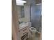 Contemporary bathroom features a vanity with storage and glass-enclosed shower, creating a clean and efficient space at 754 71St N Ave, St Petersburg, FL 33702