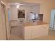 Bright kitchen featuring white cabinetry, butcher block countertops, and modern appliances at 754 71St N Ave, St Petersburg, FL 33702