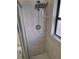 Updated shower with detachable head, gray tiling, and clear glass door for a modern and clean look at 754 71St N Ave, St Petersburg, FL 33702