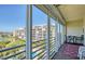 Relaxing balcony offers beautiful views of the pool, water, and nearby buildings at 7872 Sailboat Key S Blvd # 404, South Pasadena, FL 33707