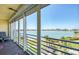 A balcony with a seating area providing stunning views of the waterfront and the community at 7872 Sailboat Key S Blvd # 404, South Pasadena, FL 33707
