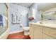 Cozy bathroom with a vanity, toilet, bathtub, and decorative blue and white wall decor at 7872 Sailboat Key S Blvd # 404, South Pasadena, FL 33707