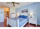 Comfortable bedroom with a beautiful bed and furniture and a bathroom in the background at 7872 Sailboat Key S Blvd # 404, South Pasadena, FL 33707