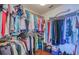 Walk-in closet with custom storage solutions and ample space for clothes and accessories at 7872 Sailboat Key S Blvd # 404, South Pasadena, FL 33707