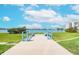 Scenic dock with benches overlooking the water and beautiful blue skies at 7872 Sailboat Key S Blvd # 404, South Pasadena, FL 33707