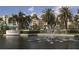 Stunning exterior of Harbour Side with towering palm trees, fountain and manicured landscaping at 7872 Sailboat Key S Blvd # 404, South Pasadena, FL 33707