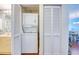 A laundry closet with a stacked washer and dryer offers convenient laundry solutions for space saving at 7872 Sailboat Key S Blvd # 404, South Pasadena, FL 33707