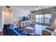 Inviting living room with a balcony, sleek floors, and ample natural light at 7872 Sailboat Key S Blvd # 404, South Pasadena, FL 33707