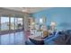 Bright living room featuring stylish furniture and a sliding glass door to a balcony at 7872 Sailboat Key S Blvd # 404, South Pasadena, FL 33707