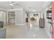 Open-concept living area featuring modern finishes, abundant light, and a glimpse of kitchen at 827 Virginia St, Dunedin, FL 34698