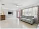 Spacious living room features sleek flooring, contemporary furnishings, and recessed lighting at 827 Virginia St, Dunedin, FL 34698