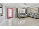 Bright living room with neutral tones, comfortable sofas, and stylish decor at 827 Virginia St, Dunedin, FL 34698