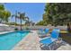 Backyard pool area with pavers and three lounge chairs at 827 Virginia St, Dunedin, FL 34698