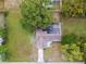 Birds-eye view of single-story home featuring new solar panels, a driveway, and a large yard in a quiet neighborhood setting at 8512 Longboat Ln, Hudson, FL 34667