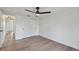 Bright bedroom with sleek hardwood floors and a double door closet at 8512 Longboat Ln, Hudson, FL 34667