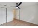 Bedroom featuring modern ceiling fan, with doors to closet and hallway at 8512 Longboat Ln, Hudson, FL 34667
