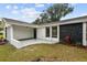 Charming single-story home boasts a modern exterior with a well-maintained front yard at 8512 Longboat Ln, Hudson, FL 34667