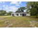 Charming single-story home boasts a modern exterior with a well-maintained front yard at 8512 Longboat Ln, Hudson, FL 34667