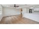 Living room and kitchen combo with recessed lighting and hardwood flooring at 8512 Longboat Ln, Hudson, FL 34667