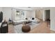 Comfortable living area with large window, light hardwood floors, and stylish decor at 8512 Longboat Ln, Hudson, FL 34667