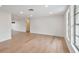 Bright living room features hardwood floors, recessed lighting and large windows at 8512 Longboat Ln, Hudson, FL 34667