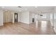 Open-concept living space with hardwood floors, recessed lighting, and freshly painted walls at 8512 Longboat Ln, Hudson, FL 34667