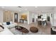 Bright, open-concept living and dining area with hardwood floors and modern decor at 8512 Longboat Ln, Hudson, FL 34667