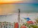 A wide sandy beach and a scenic pier extending into the ocean at 864 Mandalay Ave, Clearwater Beach, FL 33767