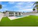 Beautiful backyard with a modern pool and well-kept lawn, creating a serene outdoor living space at 864 Mandalay Ave, Clearwater Beach, FL 33767