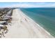 Expansive beachfront with clear blue water, showcasing the property's proximity to the beautiful coastline at 864 Mandalay Ave, Clearwater Beach, FL 33767