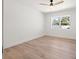 Bright bedroom features wood floors, a modern ceiling fan, and a window with natural light at 864 Mandalay Ave, Clearwater Beach, FL 33767
