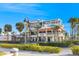 A modern building showcases outdoor seating, and commercial and retail space at 864 Mandalay Ave, Clearwater Beach, FL 33767
