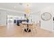 Bright dining area with modern chandelier, flowing into an open concept floorplan at 864 Mandalay Ave, Clearwater Beach, FL 33767